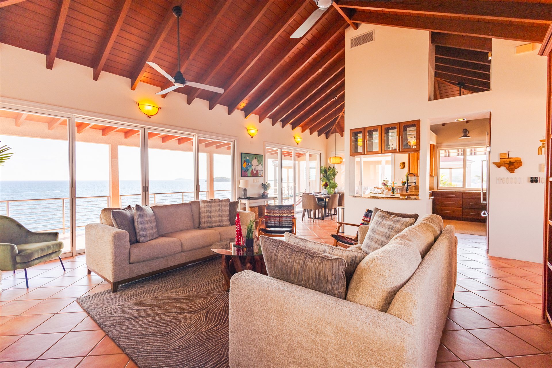 Elegant open-concept living room with designer furnishings at Ocean Pointe Caribe luxury villa